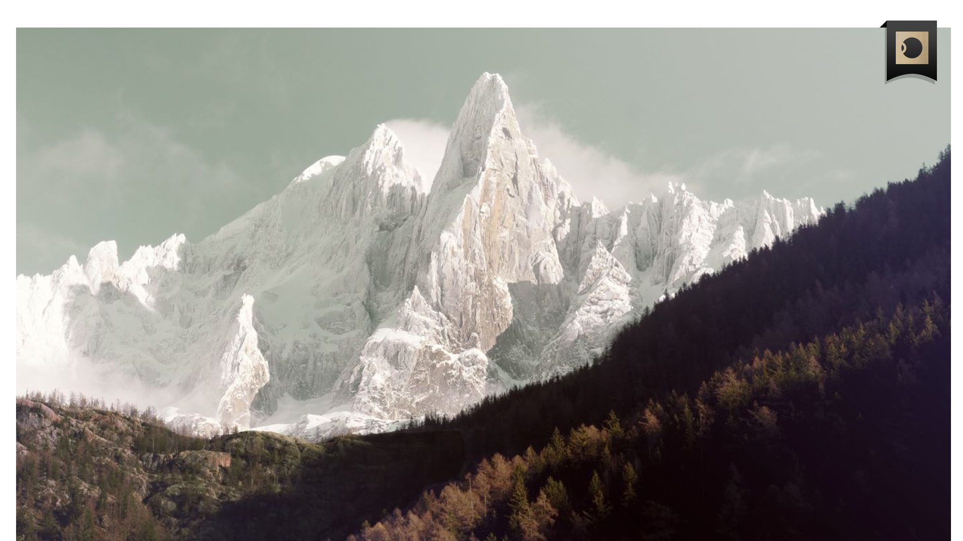 Stylised photograph of snowy mountain peaks with AOP ICON symbol in top-right corner.